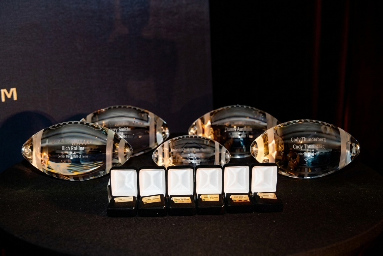 Masterfully etched crystal footballs and rings for the Senior Bowl Hall of Fame